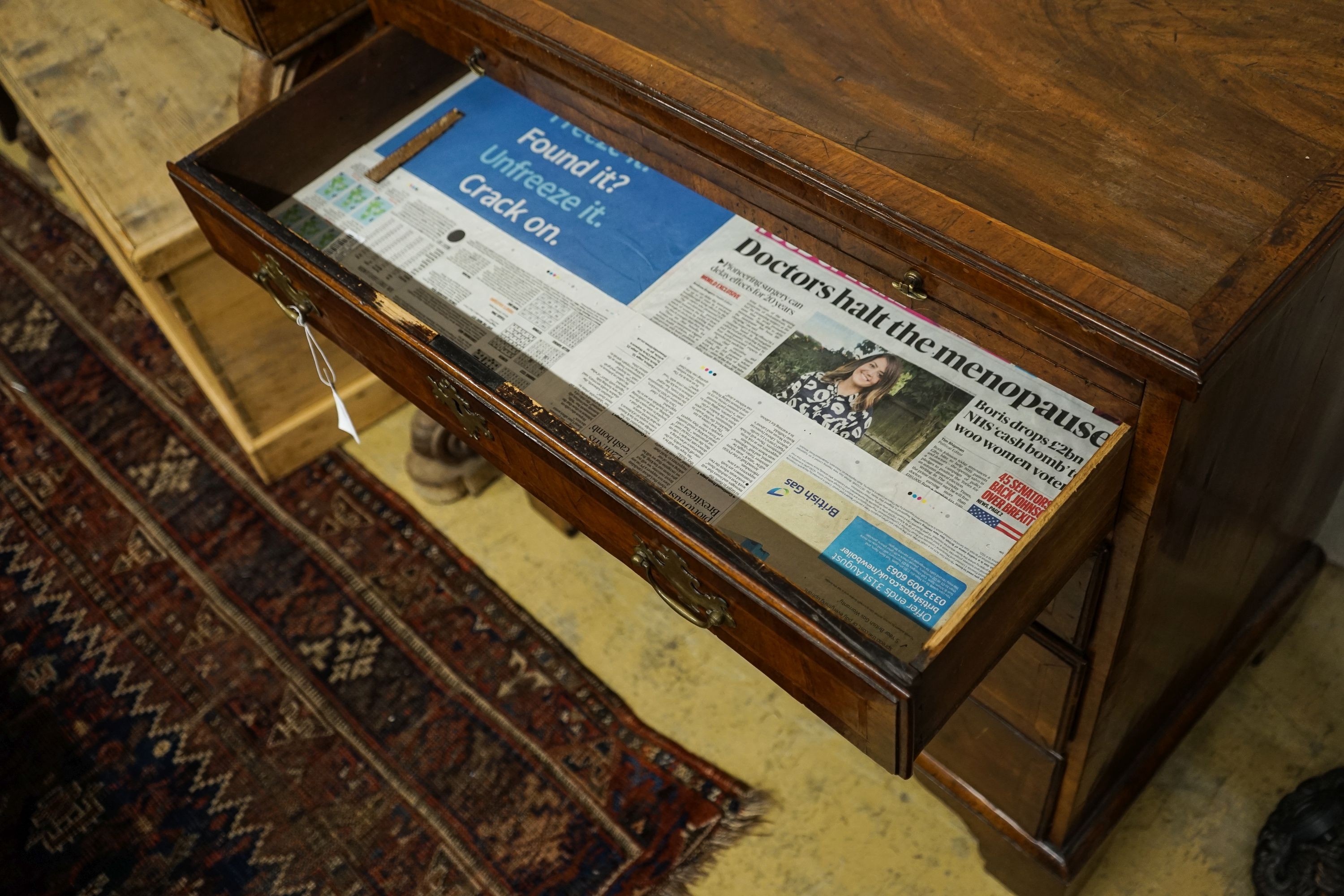 An 18th century and later feather banded walnut chest with slide, width 84cm, depth 49cm, height 86cm